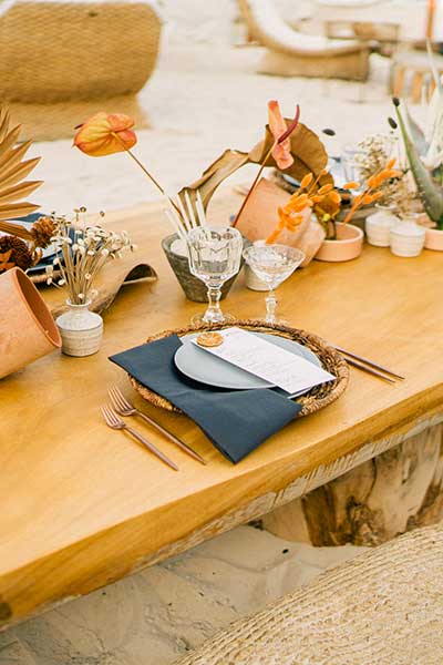 Restaurant table set with a beautiful joia feast and cocktails