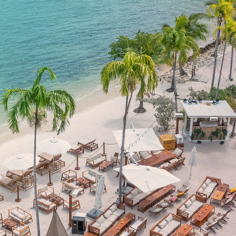 Luxury beachfront lounge at Joia Beach Miami with ocean views and upscale seating